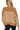 Back view of oversized camel sweater with wide horizontal stripe layout