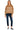 Model view wearing striped oversized sweater styled with blue trousers