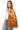 Model wearing light brown suede fringe bag with slouchy hobo shape and minimalist style