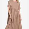 Woman in taupe midi dress with a flowy, relaxed fit for understated elegance.