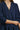 Close-up of navy corduroy texture with tiered seam details