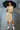 African American model in beige turtleneck sweater dress with clear rain boots and umbrella on rainy street