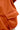 Close-up of an orange jacket with a pocket on a white background