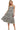 Model in washed gingham dress styled with sandals for a sunny day