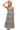 Women's washed black dress front view with tiered silhouette and gingham trim details