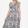 Elegant black and white patterned midi dress for women, perfect for casual and semi-formal wear.
