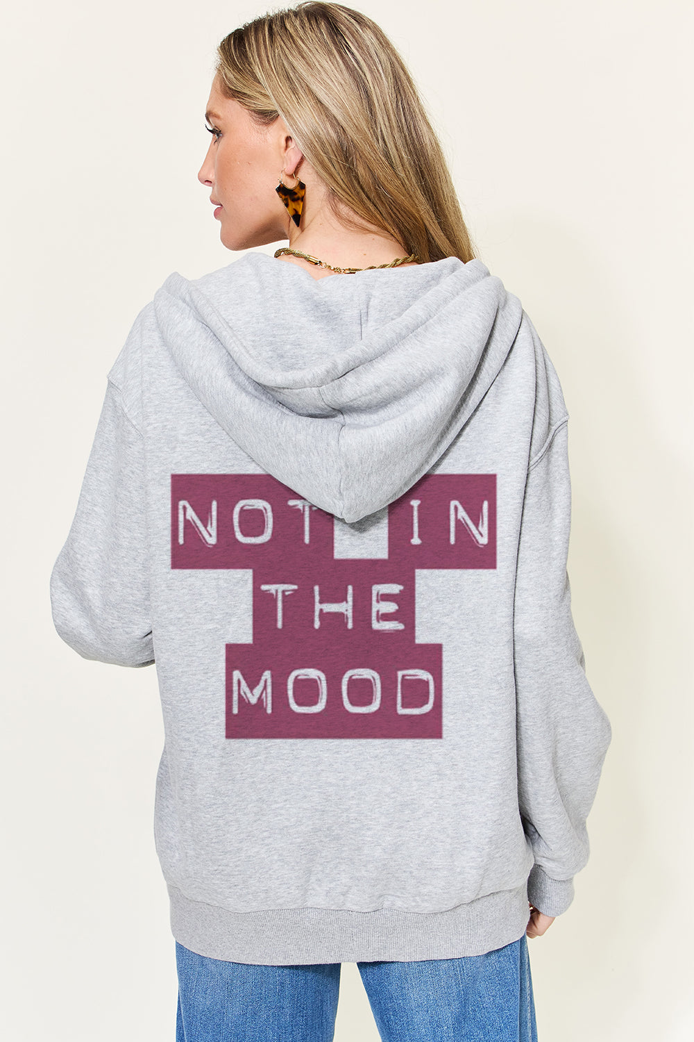 Back view of the graphic hoodie, highlighting its easy-wear design and sleeve length.