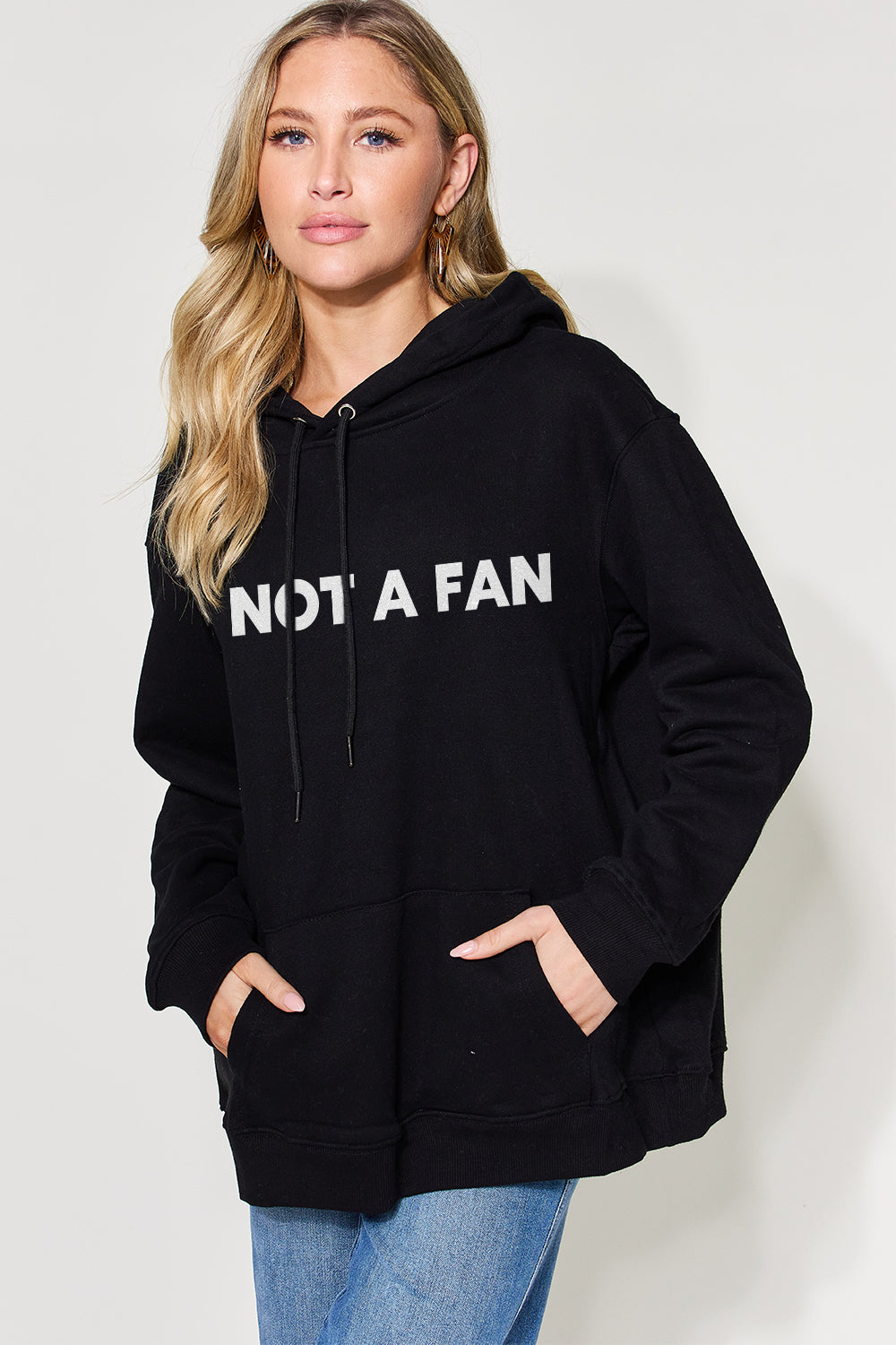 Casual 'NOT A FAN' graphic drawstring hoodie, front view.