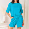 Model in stylish half-sleeve top & shorts set, front view