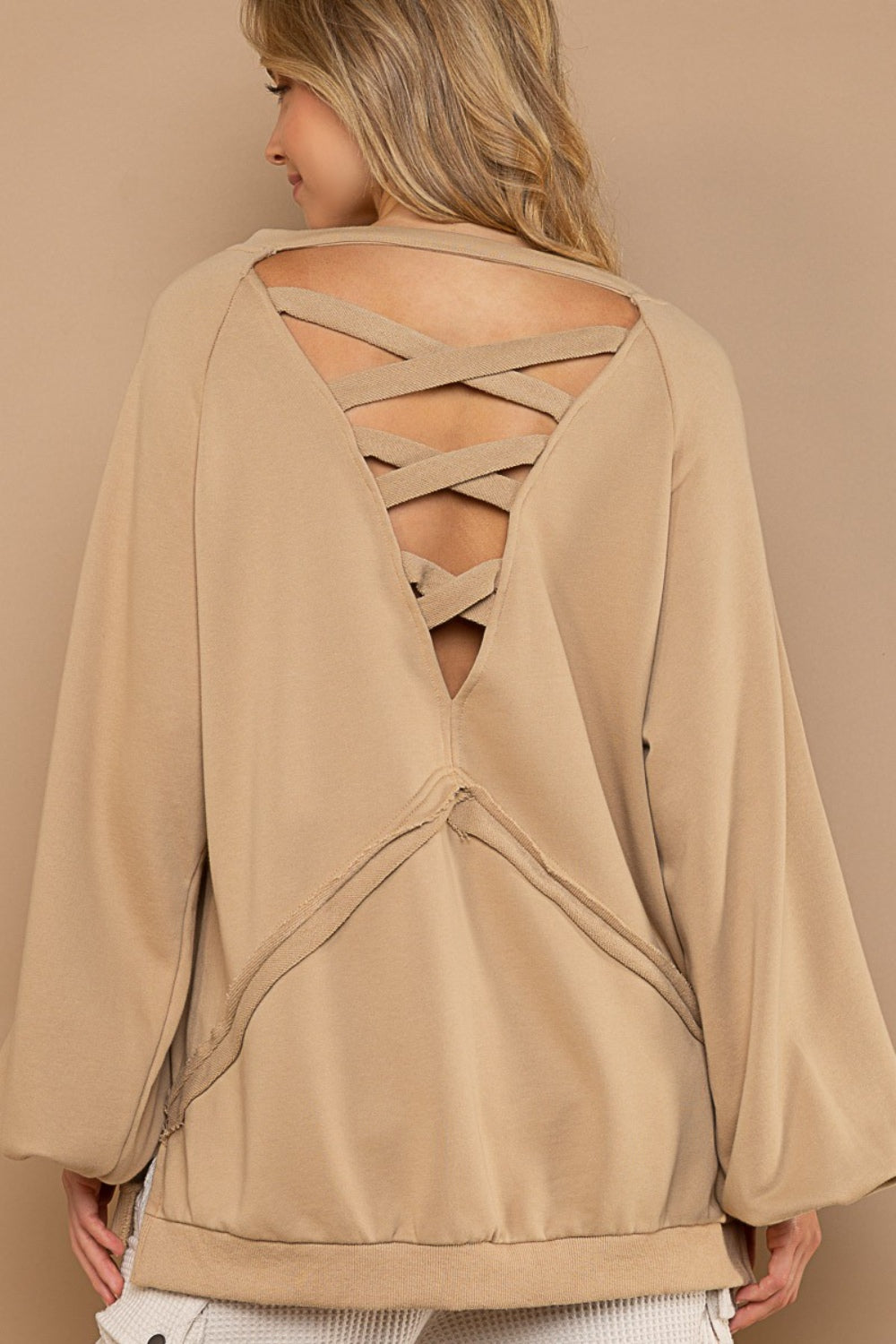 Rear view of the sweatshirt, highlighting the cross strap cutout design.