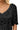 Close-up of black cotton crochet pattern with intricate lace detail.