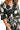 Close-up of floral print and tie waist, highlighting soft fabric and design.