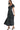 Side view of polka dot dress showing button-down front and elegant waistline.