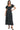 Women's black midi dress with polka dots and romantic puff sleeves.