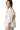 Side view of cactus print blouse showing tiered ruffles and sleeveless cut.