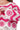 Close-up of chevron and floral crochet patterns in pink knit.