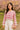 Vintage-style pink and white chevron crochet top in spring garden