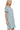 Side view of blue grey scoop neck t-shirt dress with rolled sleeves above the knee