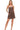 Model wearing a vintage wash romper with side pockets and adjustable spaghetti straps