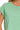 Close-up of sleeve roll, round neckline, and cotton fabric texture.