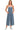 Main view of medium wash denim wide leg overalls with pocket detail.