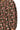 Close-up of brown and pink floral fabric, ruched stitching, and tie-neck detail
