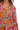 Close-up of rose floral print on lightweight woven fabric with smocked sleeve cuff detail