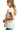 Side view of cream blouse showing relaxed fit and frayed hem detail