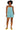 Front view of model wearing dusty teal cotton romper with square neckline and tie-back straps