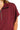 Close-up of zipper neckline and fabric texture on short sleeve top