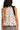 Back view of a halter neck cami top with white geometric bow print and flowy silhouette