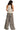 Model showing back of halter neck cami top with geometric print and flowing silhouette