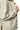 Close-up of cream jacquard fabric showing textured weave and soft sheen