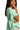 Side view of mint babydoll top showing ruffle hem and lace half sleeves