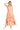 Front view of orange gingham midi dress with ruffled tiers, V-neckline, and side slit.