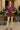 Woman posing in Mix Paisley Boho Tunic Blouse Color: Wine Mix with lace tights, palace courtyard.