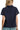 Back view of lace short sleeve shirt with relaxed fit and smooth finish