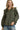 Front view of green plaid blouse showing ruffle neckline, puff sleeves, and button closure.