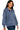 Side view of blue indigo scuba quarter zip sweatshirt with relaxed silhouette and smooth fabric.