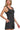 Side view of fitted romper with wide straps and above-knee shorts.
