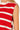 Red and white striped sleeveless top on a person with a blurred background