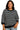 Woman wearing a black and white striped sweater on a white background