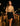 Chic evening street look with crochet top, black mini skirt, and handbag in city lights