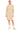 Woman wearing a beige sweater dress on a white background